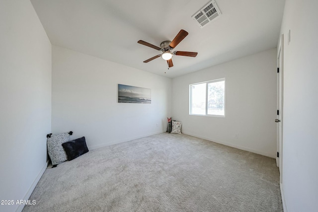 unfurnished bedroom featuring light colored carpet and ceiling fan