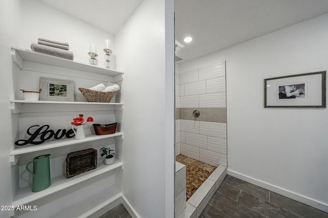 bathroom with tiled shower