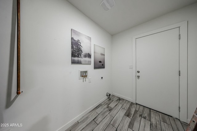 laundry room featuring washer hookup, hookup for an electric dryer, and light hardwood / wood-style floors