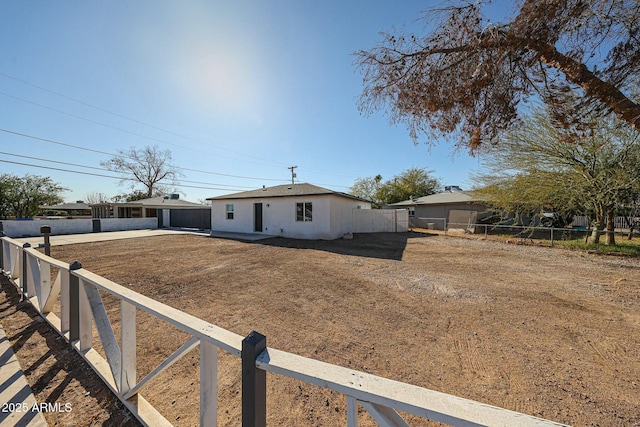 ranch-style home with a front lawn