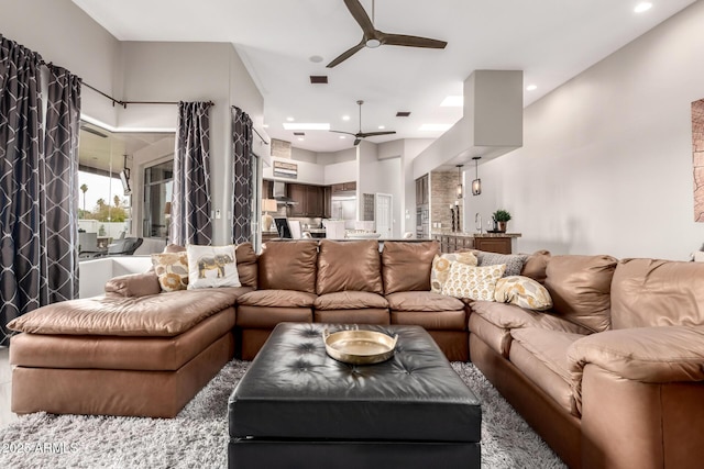 living room featuring recessed lighting, a ceiling fan, and visible vents