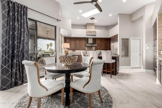 dining area featuring visible vents, baseboards, recessed lighting, light wood-style flooring, and a ceiling fan