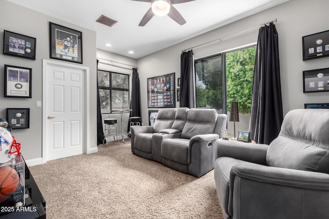 carpeted living room with recessed lighting, visible vents, baseboards, and ceiling fan