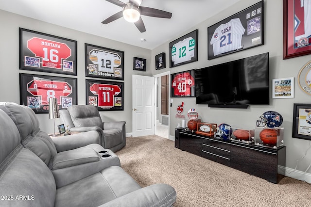 living room with a ceiling fan, baseboards, and carpet floors