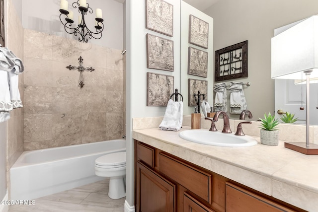 full bath featuring toilet, a notable chandelier, vanity, and shower / washtub combination