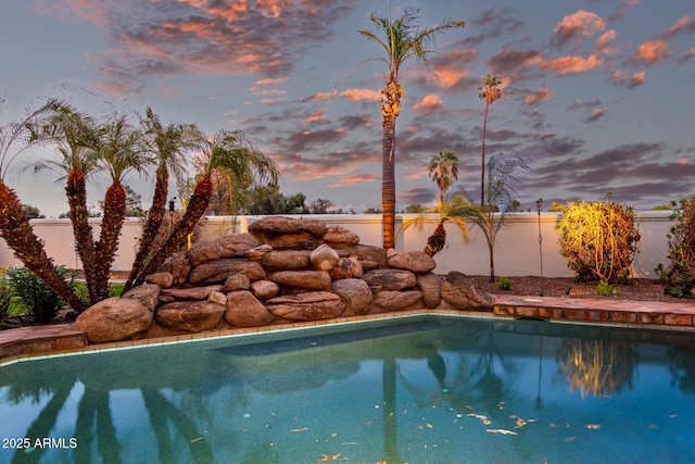 view of swimming pool featuring a fenced in pool and a fenced backyard