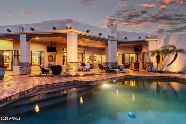 outdoor pool with a patio