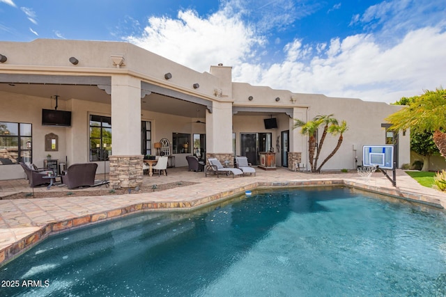 pool featuring a patio and a ceiling fan