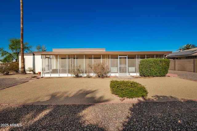 back of house with a sunroom