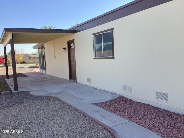 entrance to property with a patio area