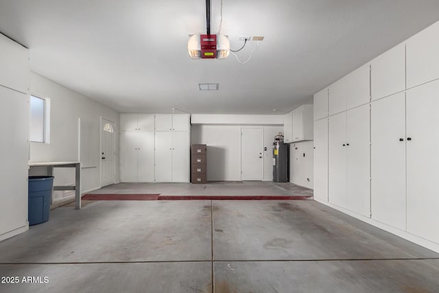 garage with water heater and a garage door opener