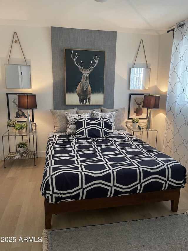 bedroom featuring wood finished floors