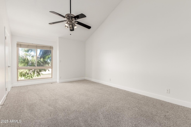 carpeted spare room featuring high vaulted ceiling and ceiling fan