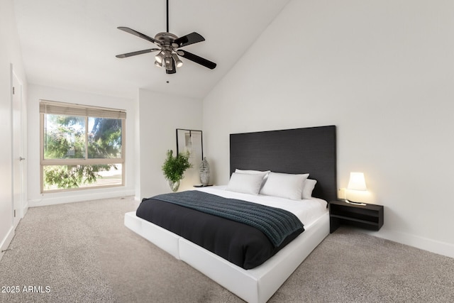 carpeted bedroom with high vaulted ceiling and ceiling fan