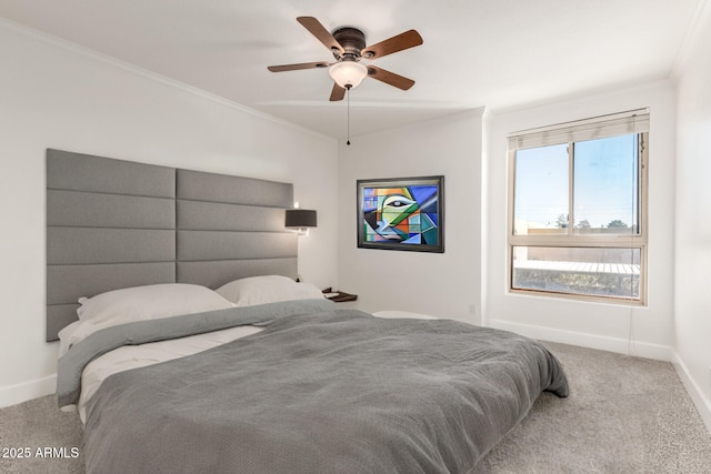 carpeted bedroom with crown molding and ceiling fan