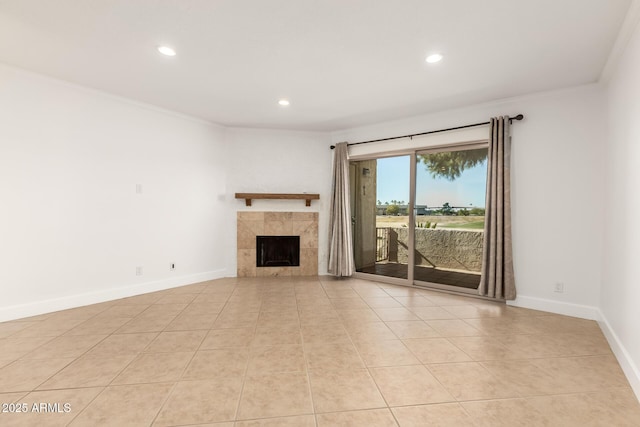 unfurnished living room featuring crown molding, light tile patterned floors, and a fireplace