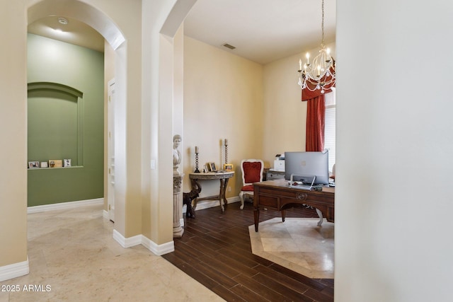 6428 W Eugie Ave, Glendale, AZ 85304 - office with arched walkways, a chandelier, baseboards, and wood finished floors
