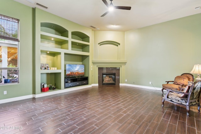 6428 W Eugie Ave, Glendale, AZ 85304 - living area featuring a ceiling fan, built in features, baseboards, and healthy amount of natural light