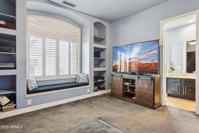 6428 W Eugie Ave, Glendale, AZ 85304 - carpeted living area featuring built in shelves