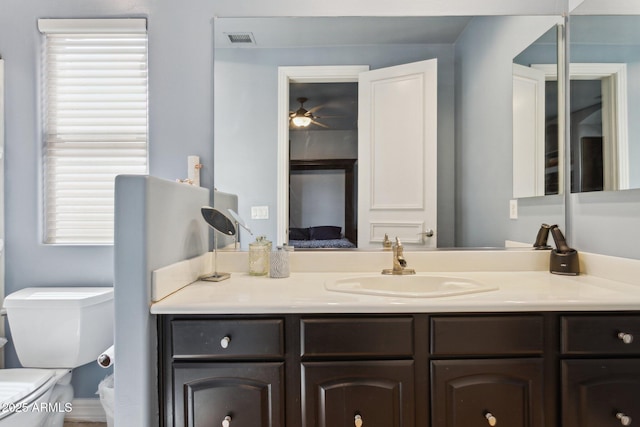 6428 W Eugie Ave, Glendale, AZ 85304 - bathroom featuring vanity, toilet, connected bathroom, and a ceiling fan
