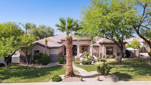 6428 W Eugie Ave, Glendale, AZ 85304 - mediterranean / spanish house with stucco siding, a front lawn, and a tiled roof