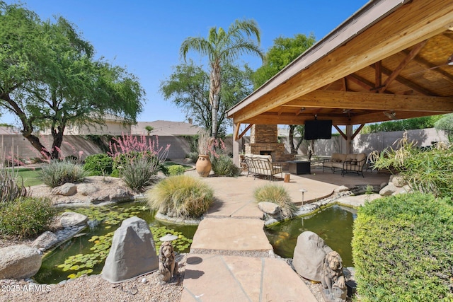 6428 W Eugie Ave, Glendale, AZ 85304 - fenced backyard with a small pond, a gazebo, exterior fireplace, and a patio