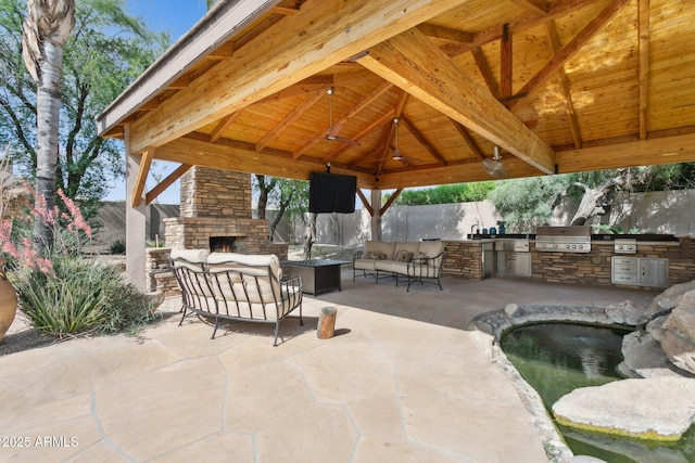 6428 W Eugie Ave, Glendale, AZ 85304 - view of patio featuring a gazebo and an outdoor living space with a fireplace