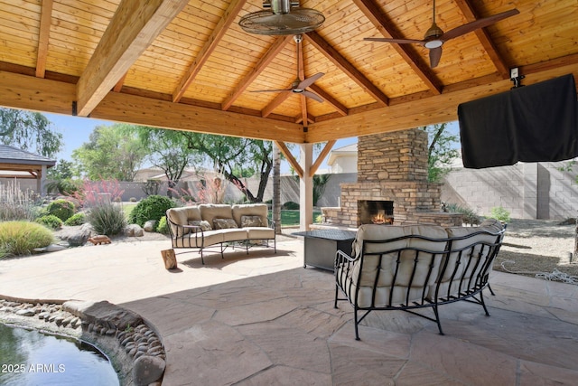 6428 W Eugie Ave, Glendale, AZ 85304 - fenced backyard with a gazebo, an outdoor living space with a fireplace, ceiling fan, and a patio area