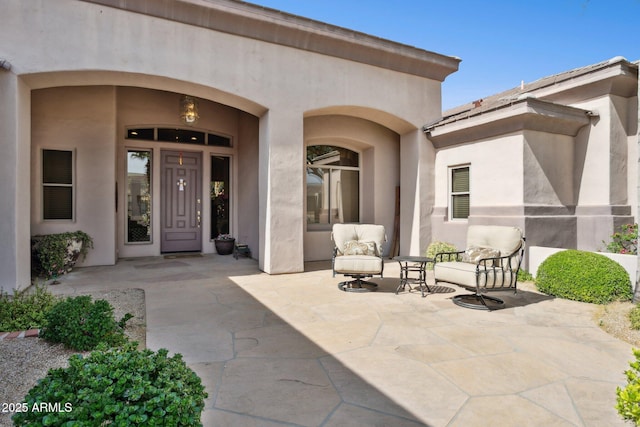 6428 W Eugie Ave, Glendale, AZ 85304 - view of exterior entry with stucco siding and a patio