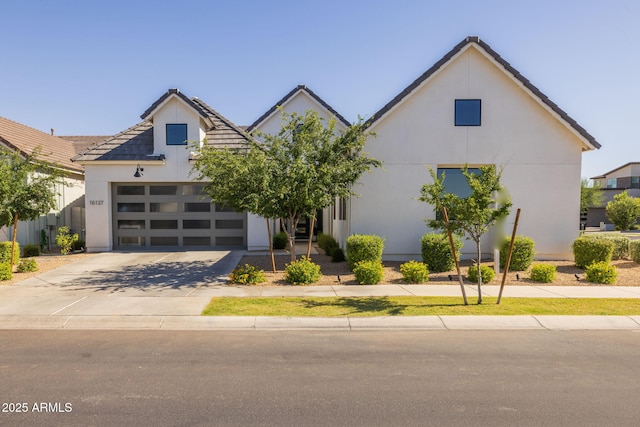 10127 E Tillman Ave, Mesa, AZ 85212 - view of front of home featuring stucco siding, a garage, driveway, and a tile roof