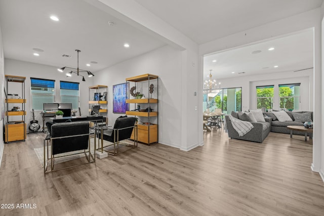 10127 E Tillman Ave, Mesa, AZ 85212 - living area with a chandelier, wood finished floors, recessed lighting, and baseboards