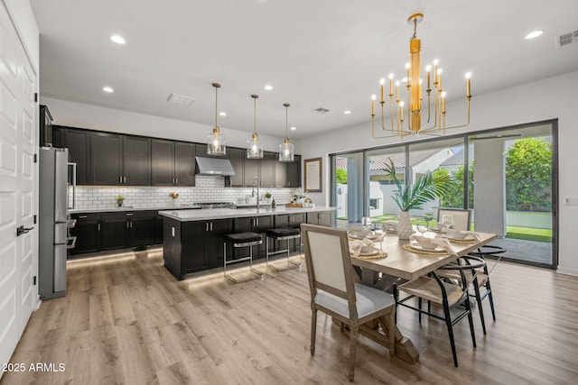 10127 E Tillman Ave, Mesa, AZ 85212 - dining space featuring light wood-style floors, recessed lighting, and a chandelier