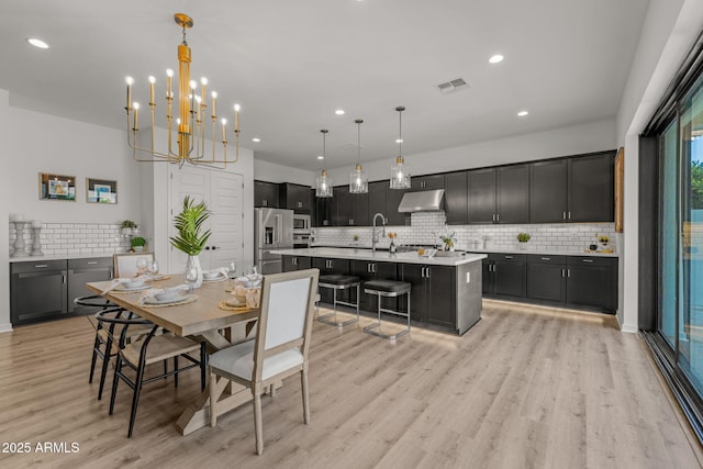 10127 E Tillman Ave, Mesa, AZ 85212 - dining space featuring light wood-style flooring, recessed lighting, and a chandelier