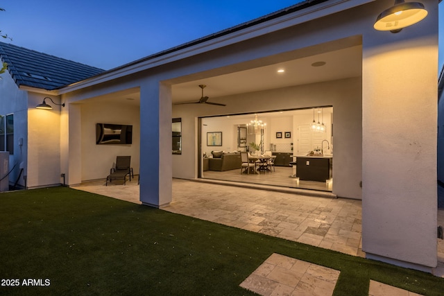 10127 E Tillman Ave, Mesa, AZ 85212 - back of house featuring a patio, stucco siding, an outdoor hangout area, ceiling fan, and a sink