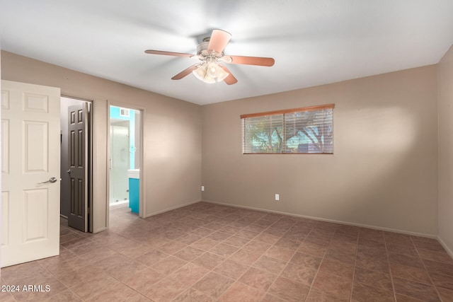 spare room with ceiling fan