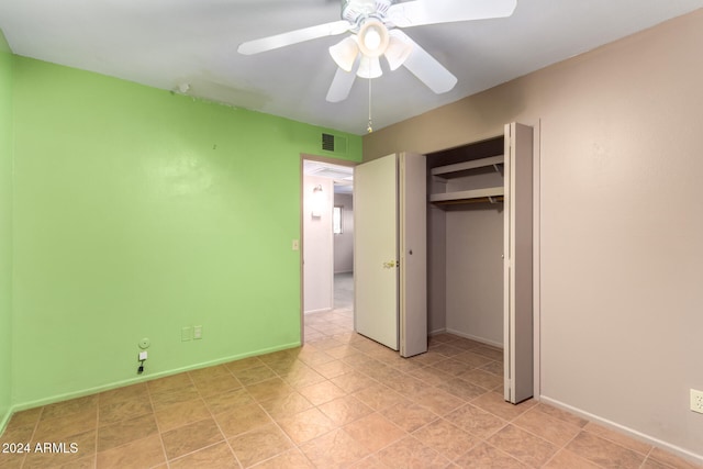 unfurnished bedroom with a closet and ceiling fan