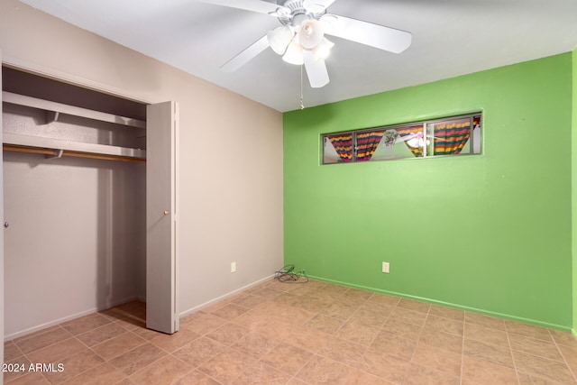 unfurnished bedroom featuring a closet and ceiling fan