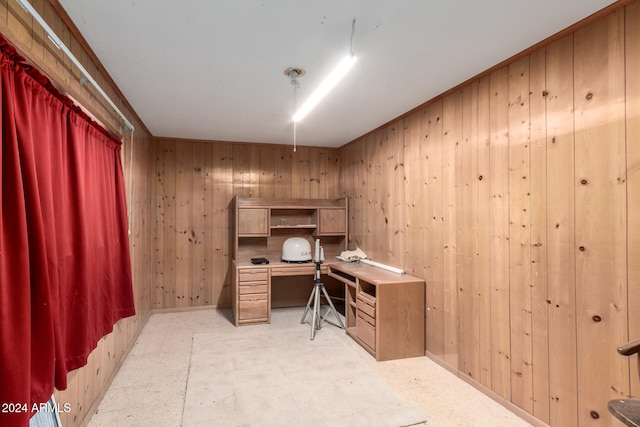 office space with wood walls