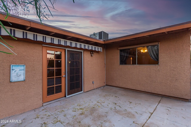 view of patio terrace at dusk