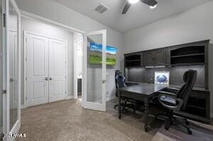 home office featuring visible vents, a ceiling fan, and french doors