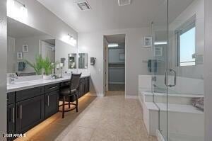 full bathroom featuring tile patterned floors, vanity, baseboards, visible vents, and a stall shower