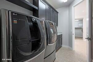 laundry room with washing machine and dryer