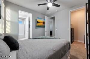 bedroom with baseboards, a ceiling fan, and carpet flooring
