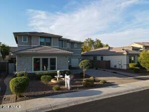traditional-style house featuring concrete driveway
