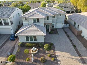 view of front of property with a residential view, driveway, and an attached garage