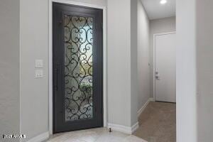 entryway featuring recessed lighting and baseboards