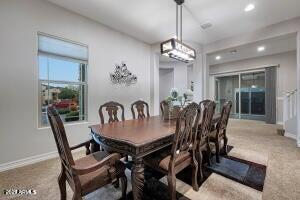 dining room featuring baseboards, recessed lighting, and carpet floors
