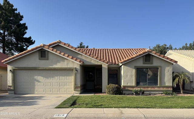 mediterranean / spanish-style home featuring concrete driveway, a front lawn, a tiled roof, a garage, and stucco siding