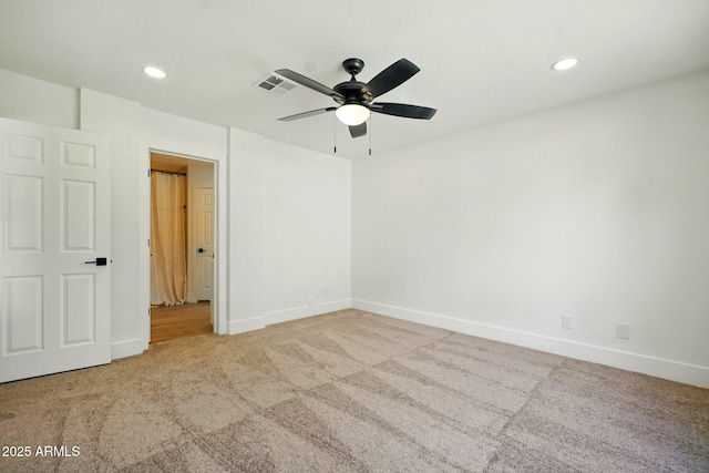 empty room with recessed lighting, ceiling fan, carpet floors, and baseboards