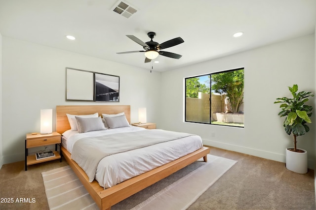 bedroom featuring recessed lighting, baseboards, visible vents, and light colored carpet
